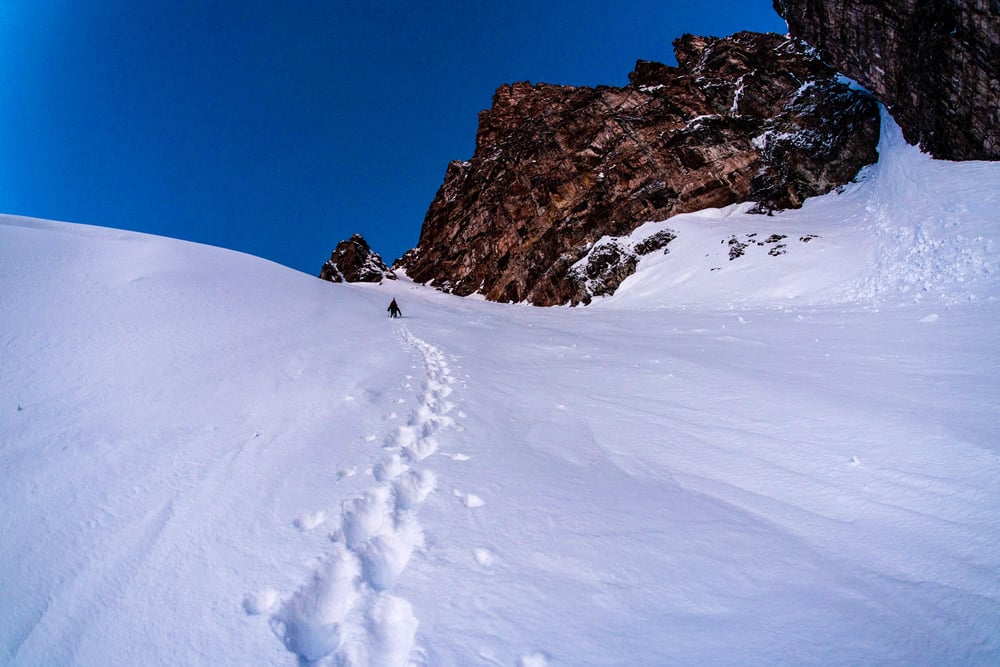 Ski mountaineering up a couloir 
