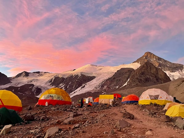 Sunrise at camp with glaciers in the background